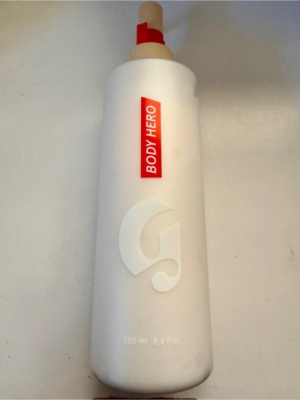 Glossier Body Hero Moisturizer — White Bottle with Red Label